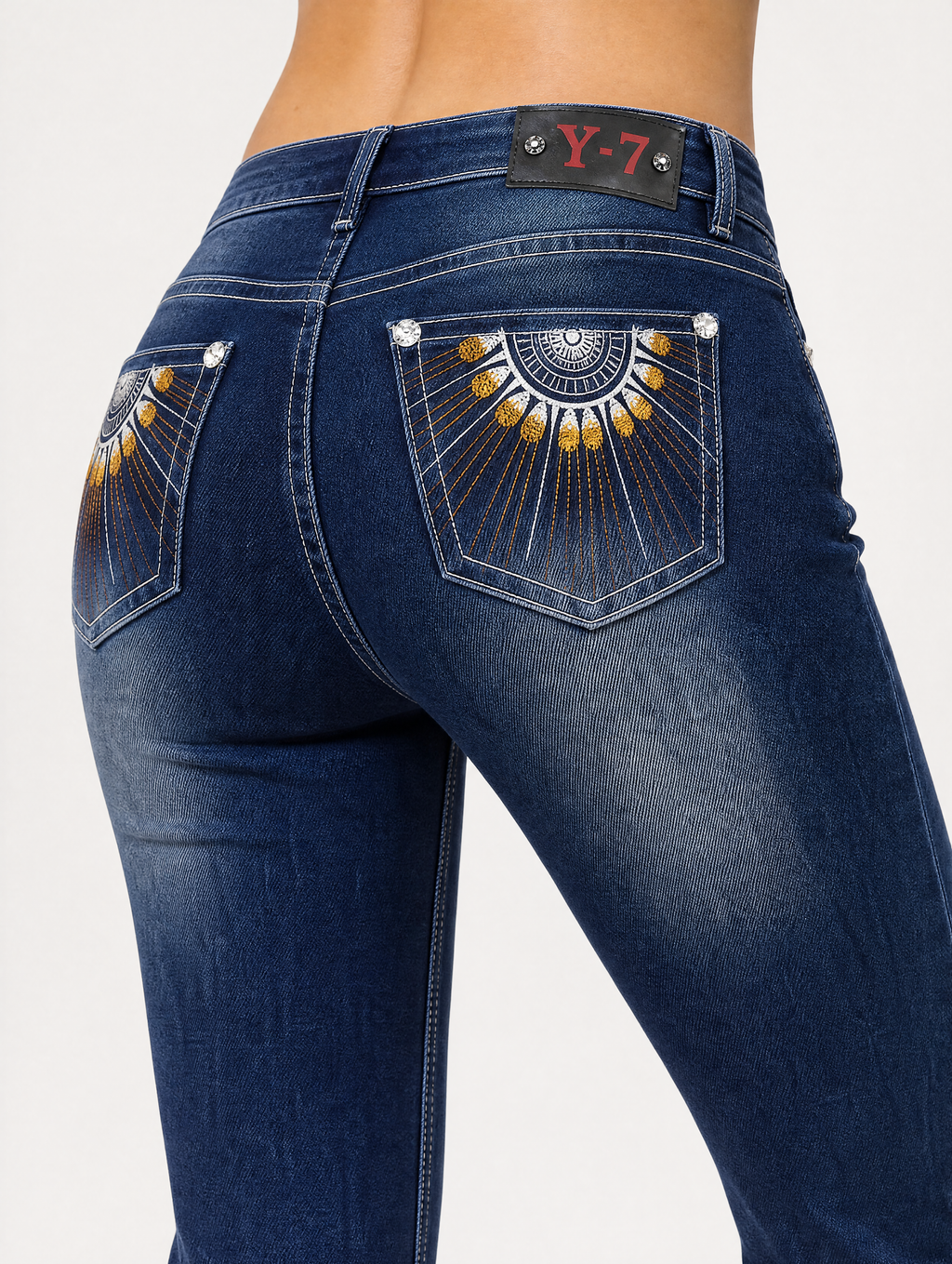 Golden sunburst embroidery back pocket close-up